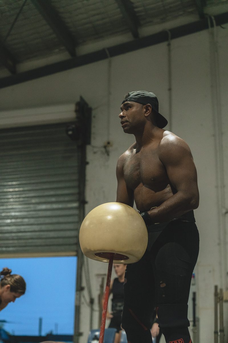 Athlete lifting a heavy atlas stone